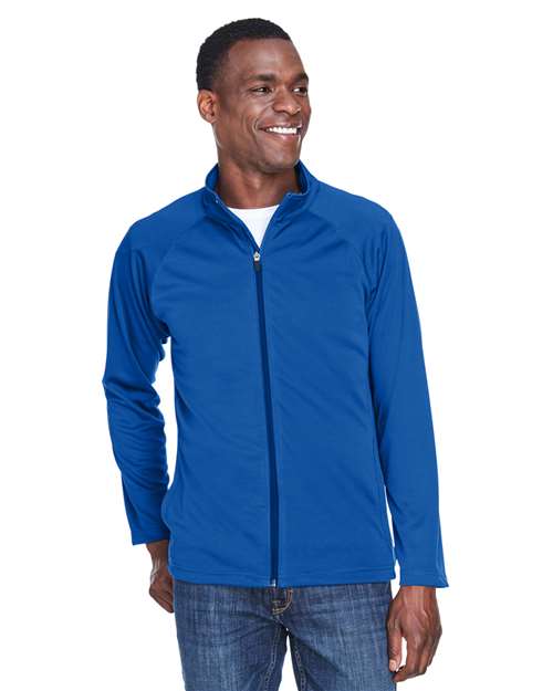 Devon & Jones Men’s Stretch Tech-Shell® Compass full-zip jacket with a sleek, modern fit and flexible performance fabric. Features a full-zip front and weather-resistant design, ideal for outdoor wear or layering.
