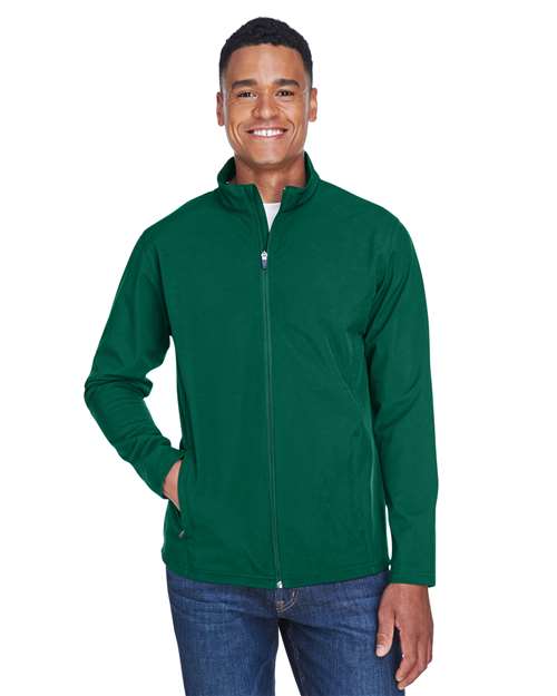 Team 365 Men’s Leader soft shell jacket with a sleek, weather-resistant design and modern fit. Features a full-zip front and durable fabric, ideal for outdoor wear and layering.