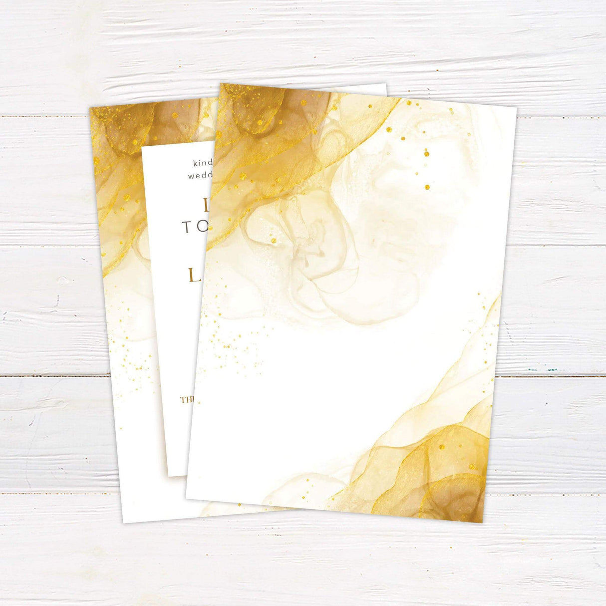 Modern abstract gold wedding invitation with marbled background, elegant serif and script fonts, and minimalist layout for formal wedding events.