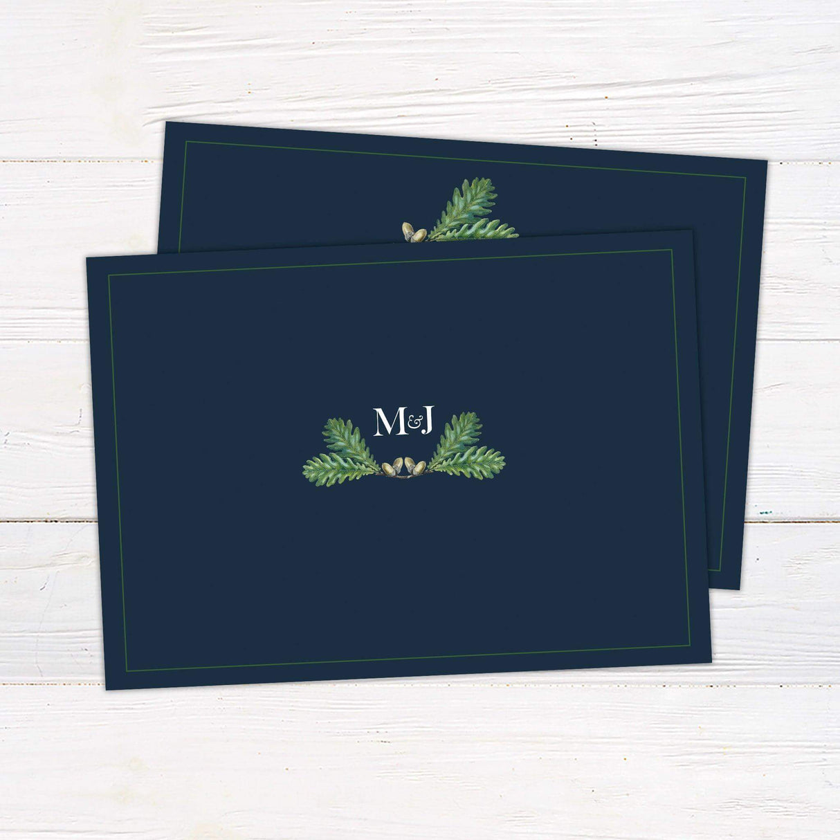 Generic wedding invitation with navy background, greenery detail, and elegant serif fonts, perfect for formal or nature-themed wedding ceremonies. back