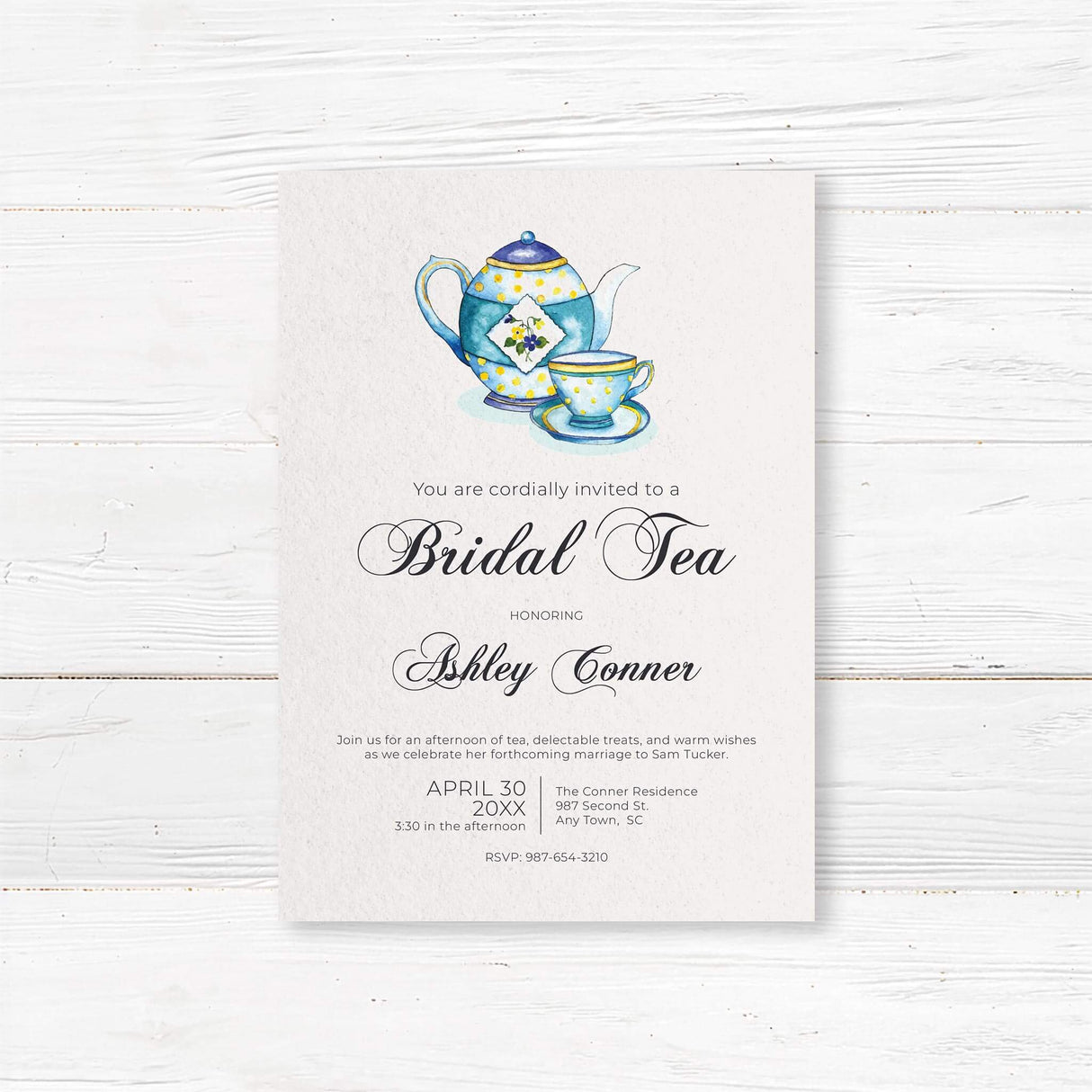 Elegant bridal tea invitation featuring a watercolor teapot and teacup design. The printed invitation includes customizable details for the bride-to-be’s name, event date, time, and location. Perfect for a sophisticated tea party celebration.