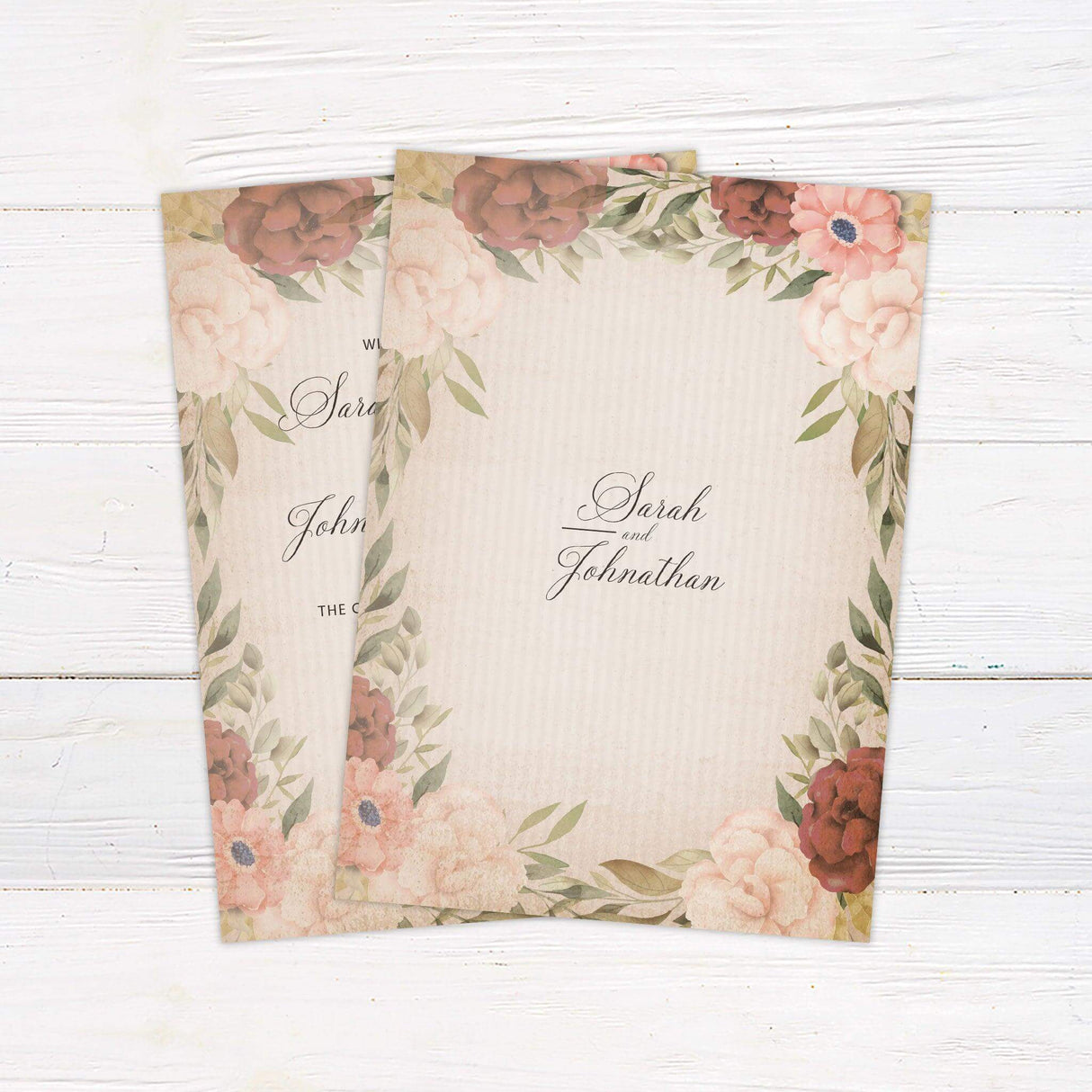 Rustic vintage wedding invitation with blush and burgundy watercolor flowers, beige textured background, and elegant script and serif typography.