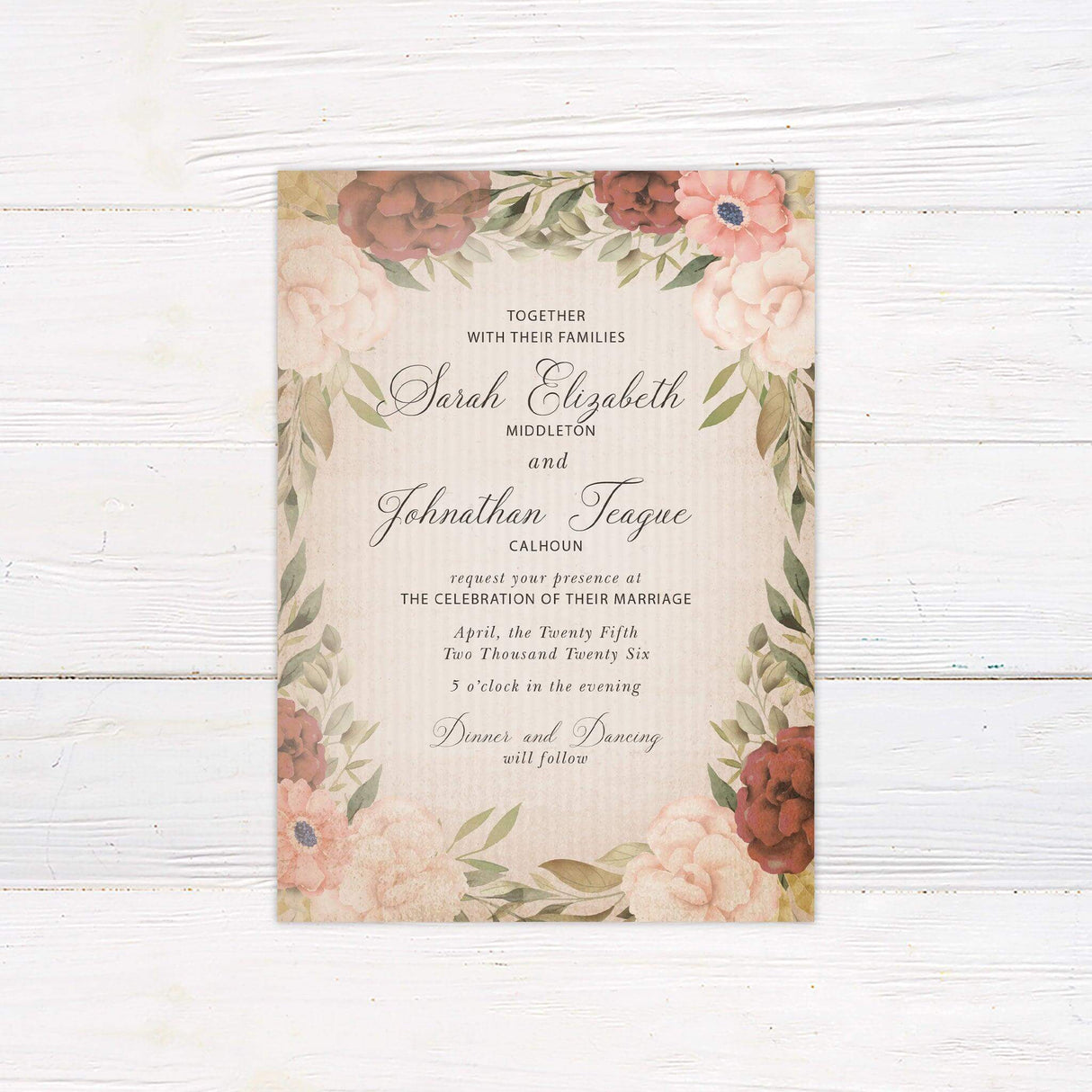 Rustic vintage wedding invitation with blush and burgundy watercolor flowers, beige textured background, and elegant script and serif typography.
