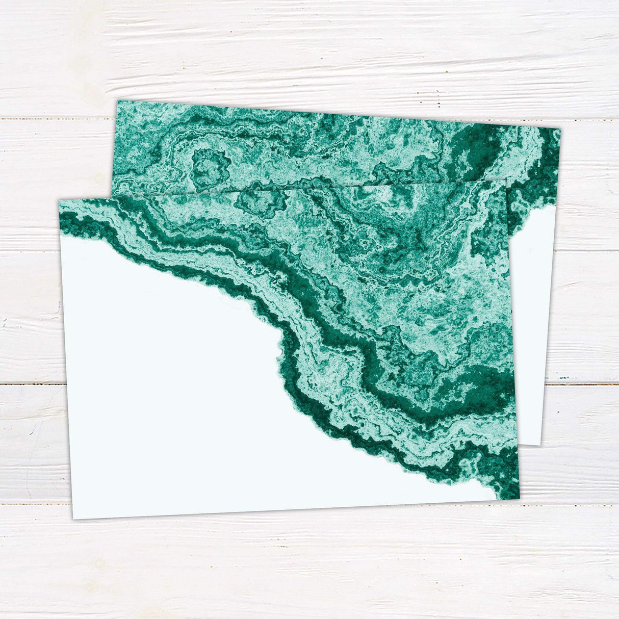 Wedding invitation with emerald green agate pattern and elegant modern script on a clean white background. back