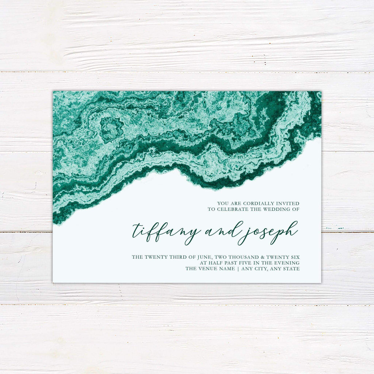 Wedding invitation with emerald green agate pattern and elegant modern script on a clean white background.