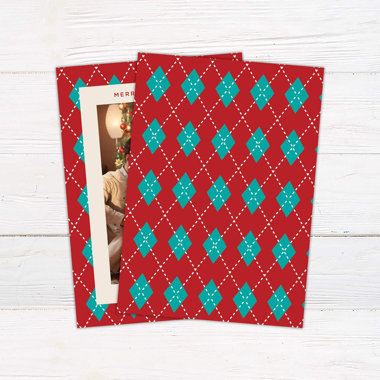 Personalized Christmas card with red and teal argyle border, family photo, and custom holiday greeting text. - back.
