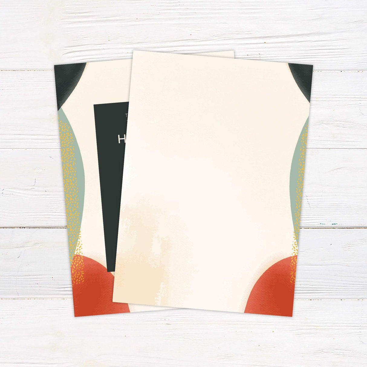 Modern wedding invitation with bold abstract shapes in red, green, and gold, dark text box, and minimalist typography on a cream background. back