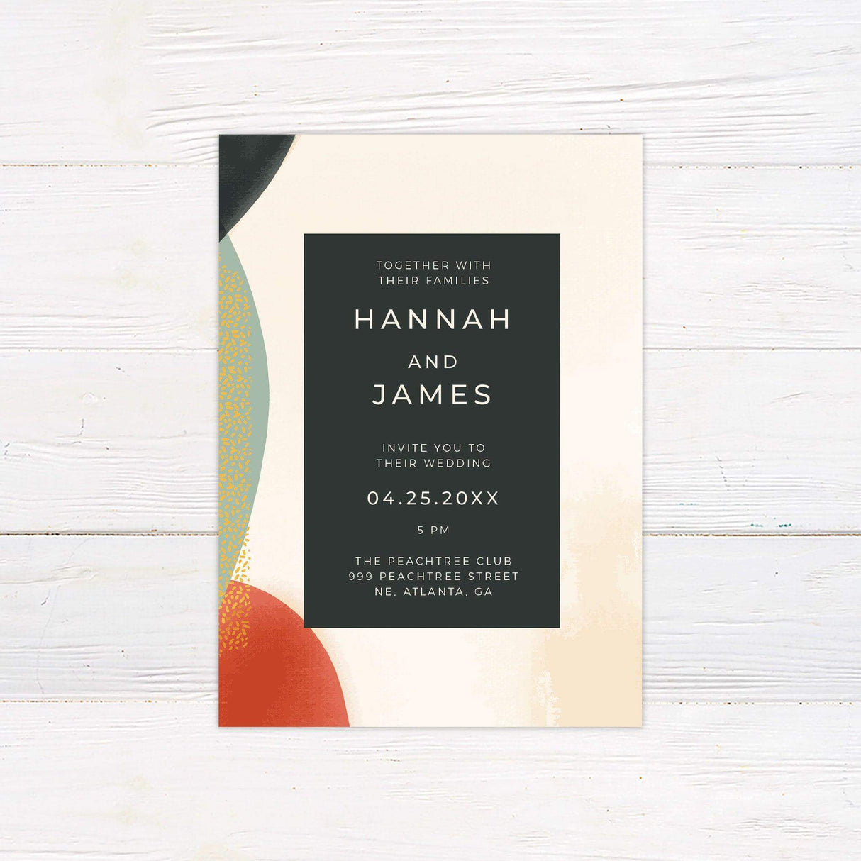 Modern wedding invitation with bold abstract shapes in red, green, and gold, dark text box, and minimalist typography on a cream background.