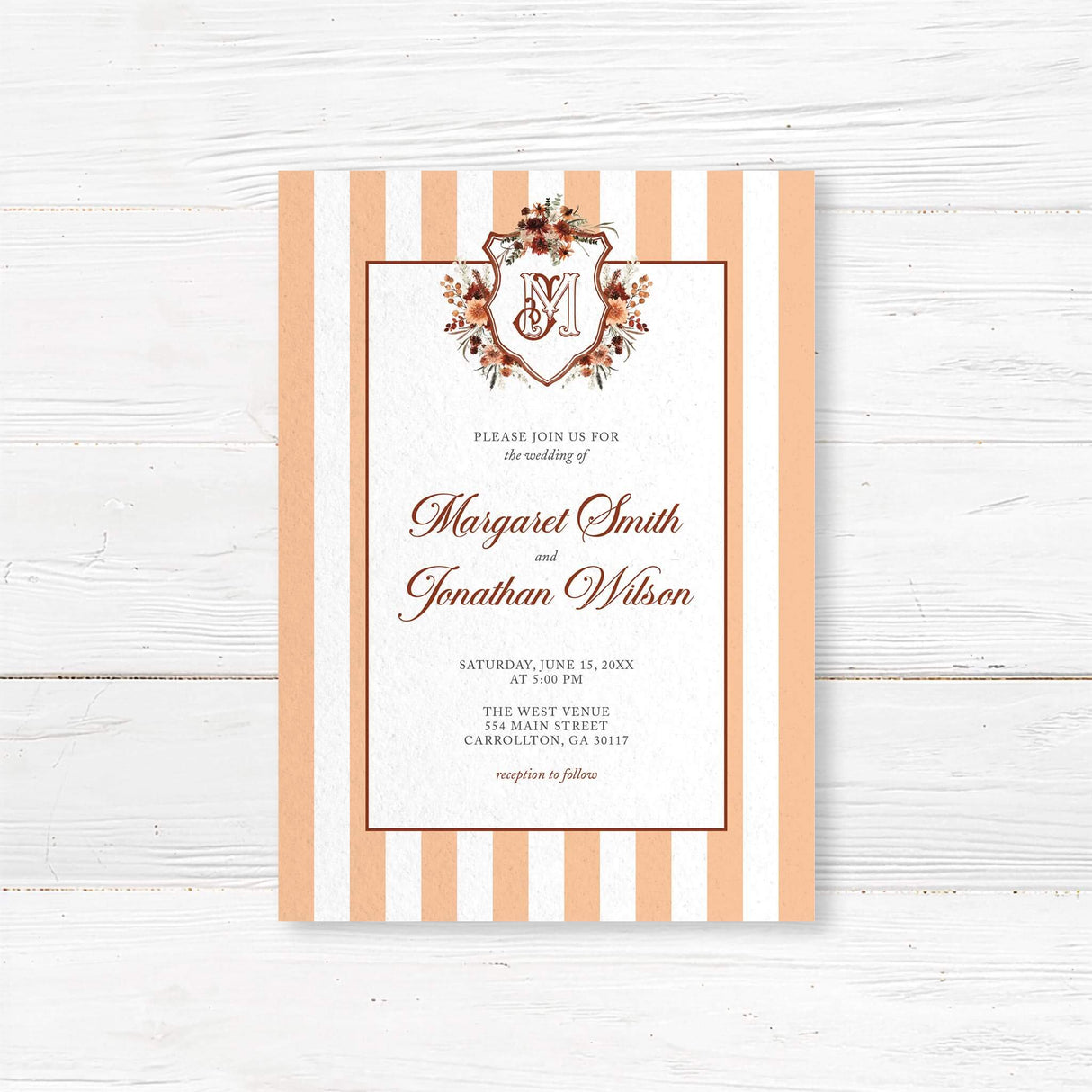 Autumn wedding invitation with floral crest monogram, terracotta and peach vertical stripes, classic script and serif fonts, and a white background for a rustic elegant wedding.