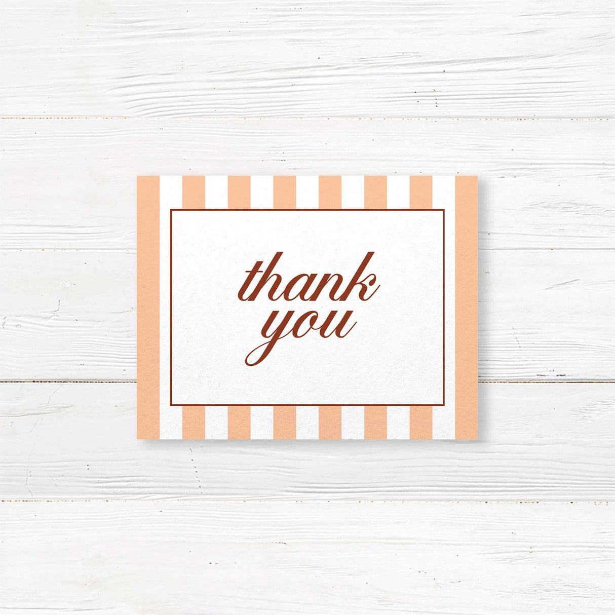 Printed thank you card with floral monogram crest, peach and terracotta stripes, and elegant fonts matching an autumn wedding suite in rustic fall colors.