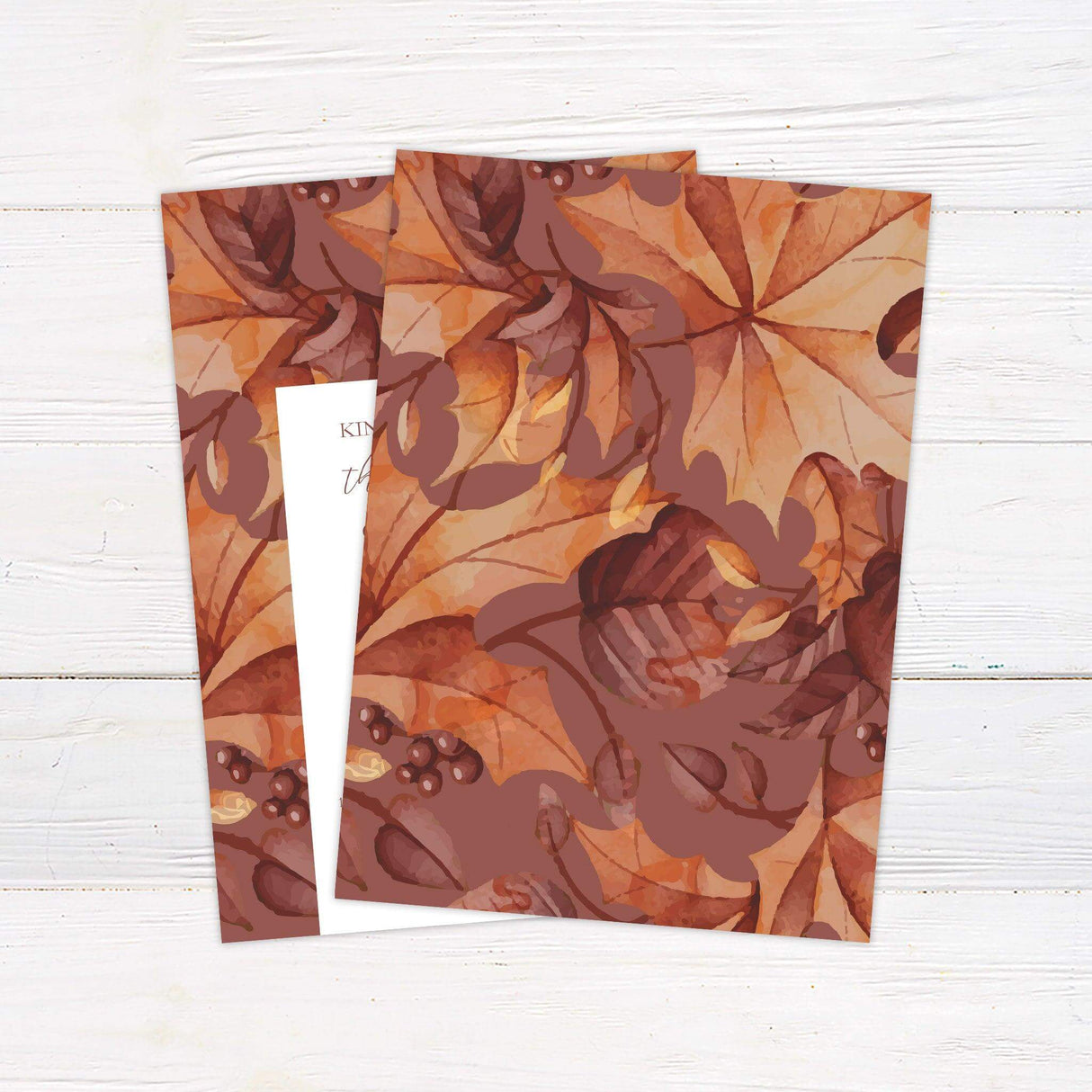 Wedding invitation with autumn foliage border in burgundy, burnt orange, and golden yellow, featuring elegant fall design elements. back