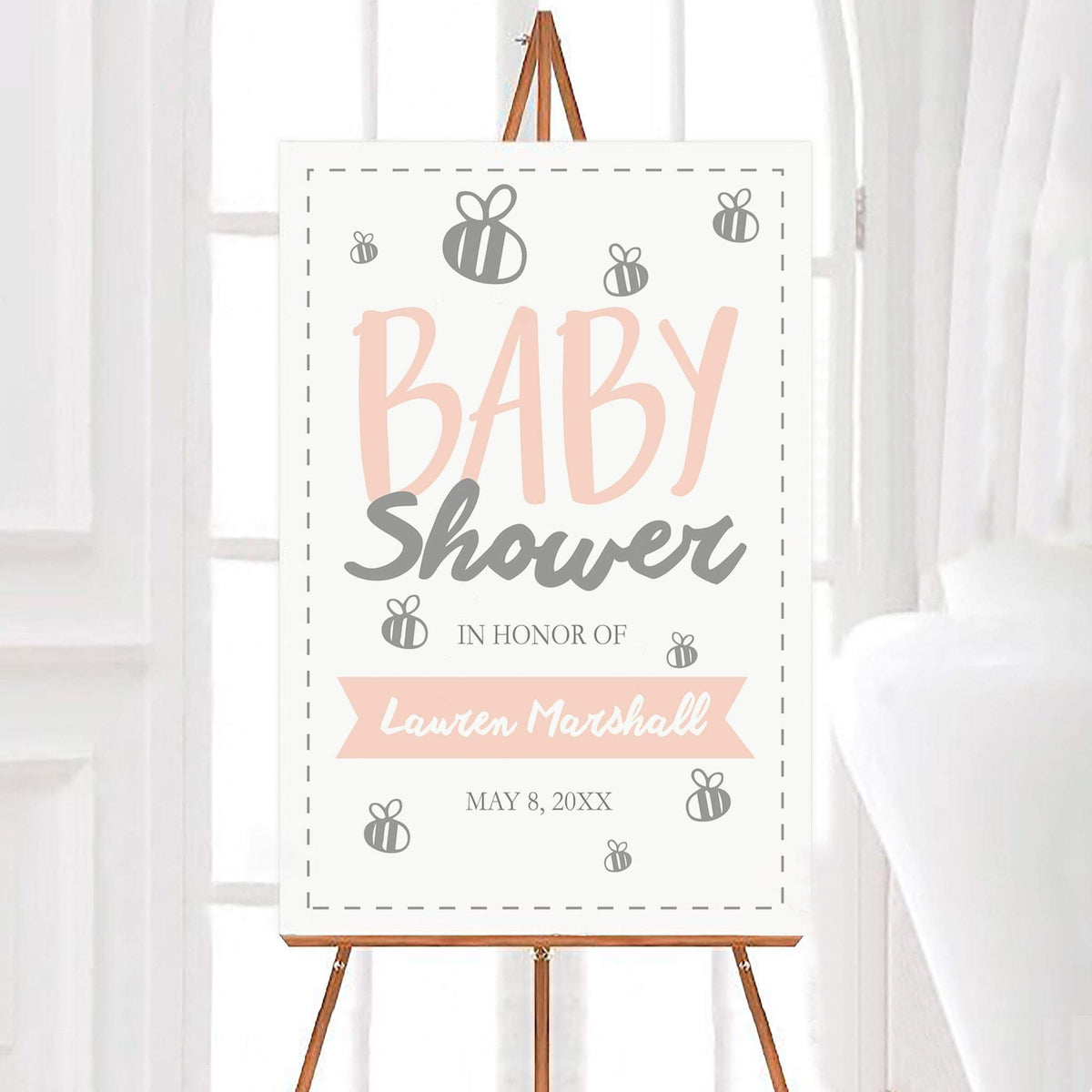 Personalized baby bumblebee baby shower welcome sign featuring soft pastel lettering, gray bee illustrations, and a decorative dashed border. The design includes a customizable name banner and event date on a clean white background.