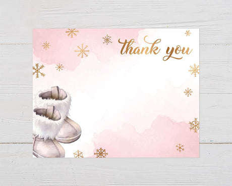 Pink baby shower thank you card with boots and gold snowflakes design.