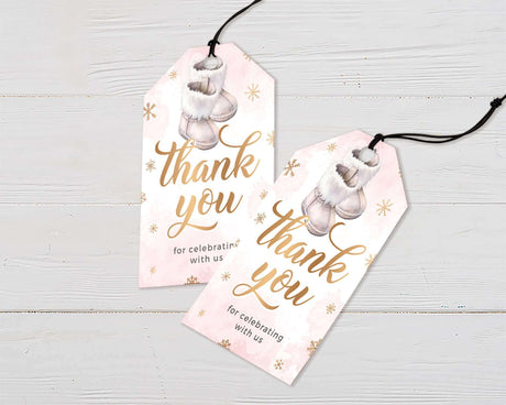 Two pink baby shower thank you tags with boots design and snowflakes, perfect for winter-themed celebrations.