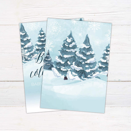 Winter-themed baby shower invitation with snowy trees for 'Baby It's Cold Outside' event.