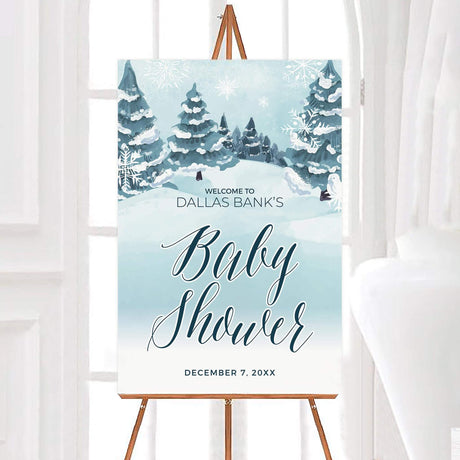 Winter-themed baby shower invitation with snowy trees and elegant script, featuring the text 'Baby Shower' for a December event.
