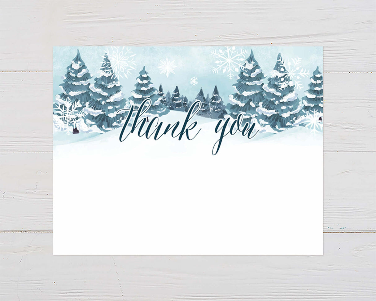 Winter thank you card with snow-covered trees and "thank you" text, perfect for a baby it's cold outside themed baby shower.