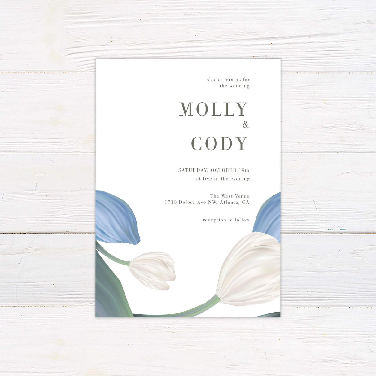Minimalist floral wedding invitation with illustrated blue and white tulips and elegant serif text on a soft ivory background for fall or garden weddings.