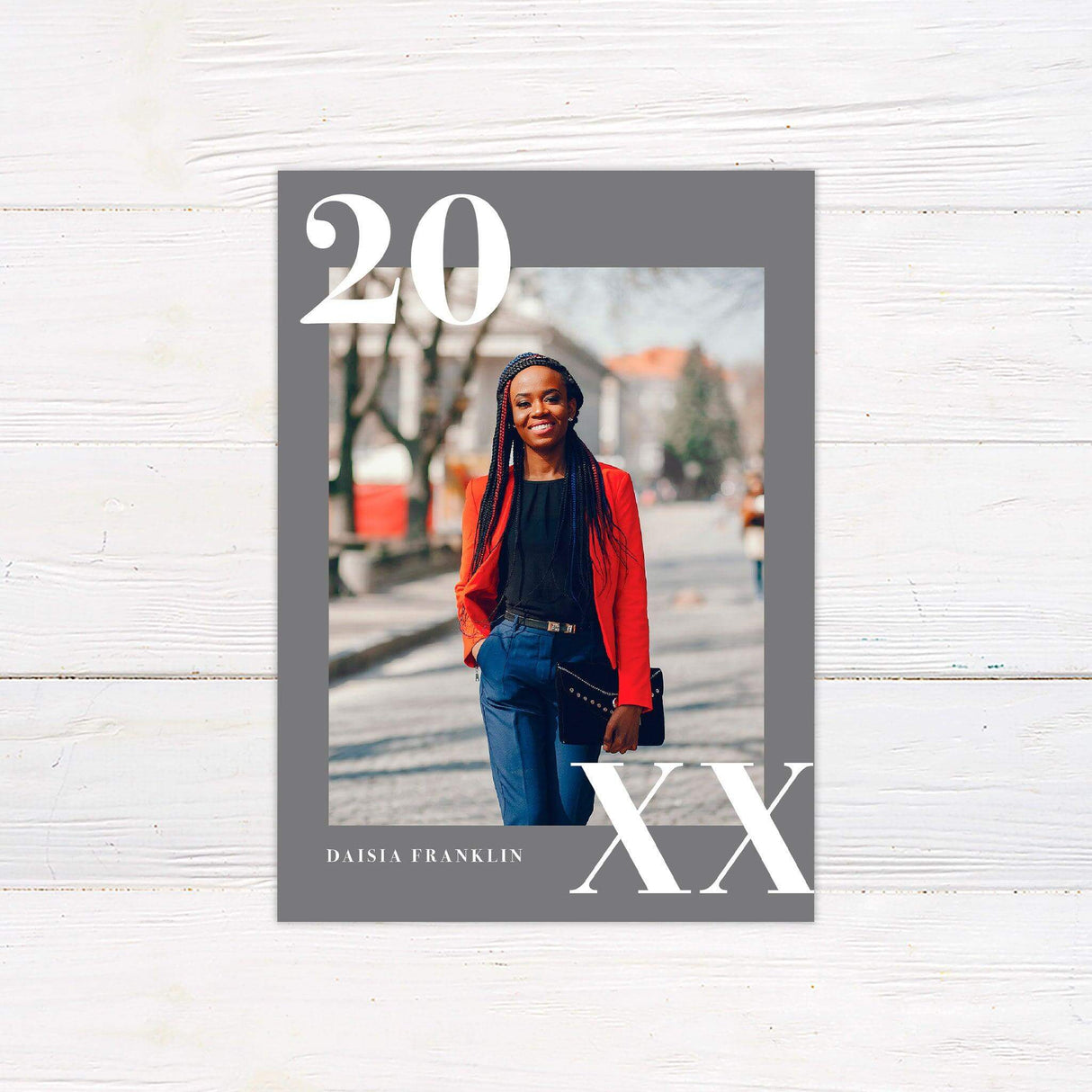 Stylish graduation invitation featuring a bold graduation year design. The back is customizable with school pride colors and includes party or graduation details. Gray.