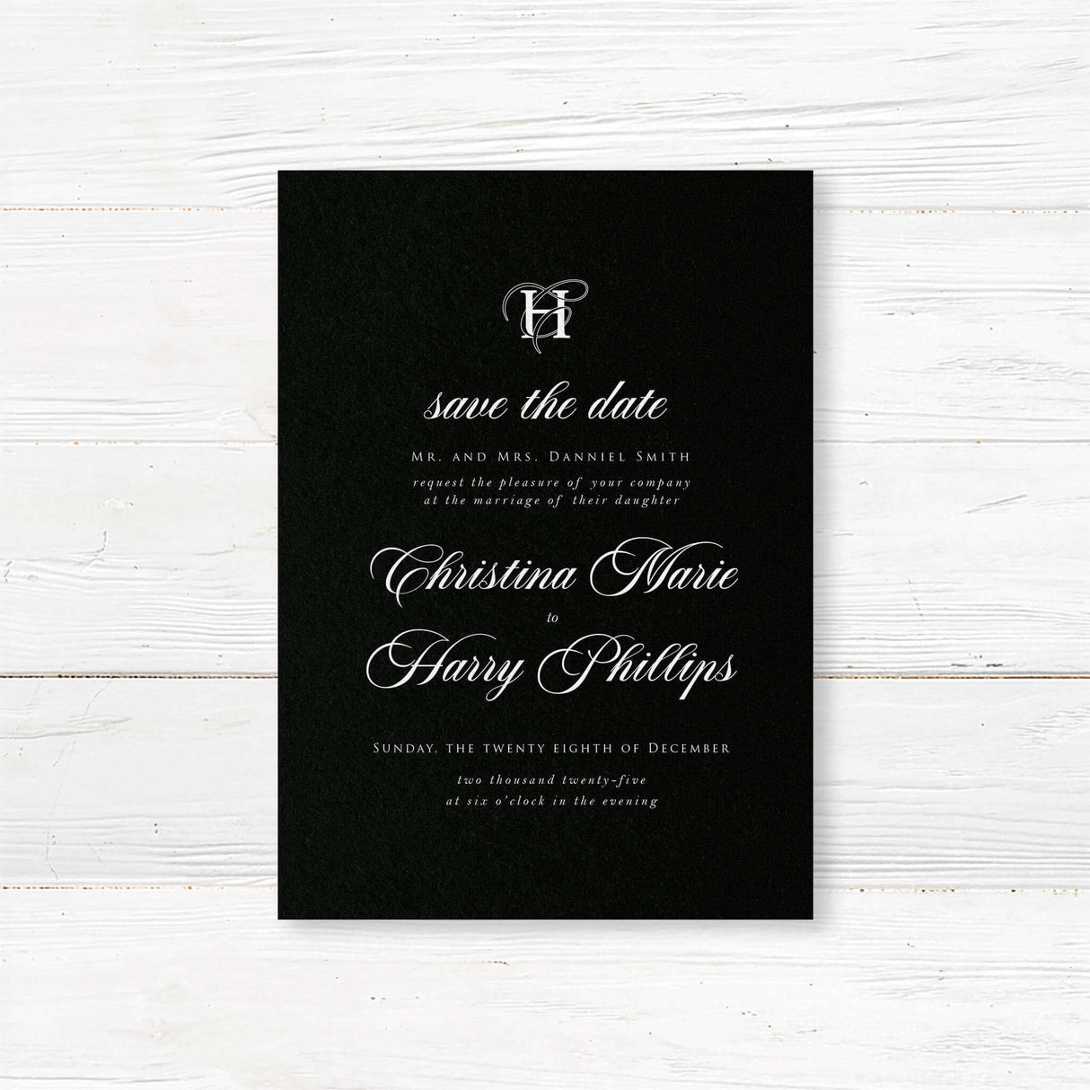 Black Entwined Initials Wedding Invitation - Save the Date card with solid black background, ornate white monogram at the top, and elegant white serif and calligraphy script fonts matching the Black Entwined Initials suite.