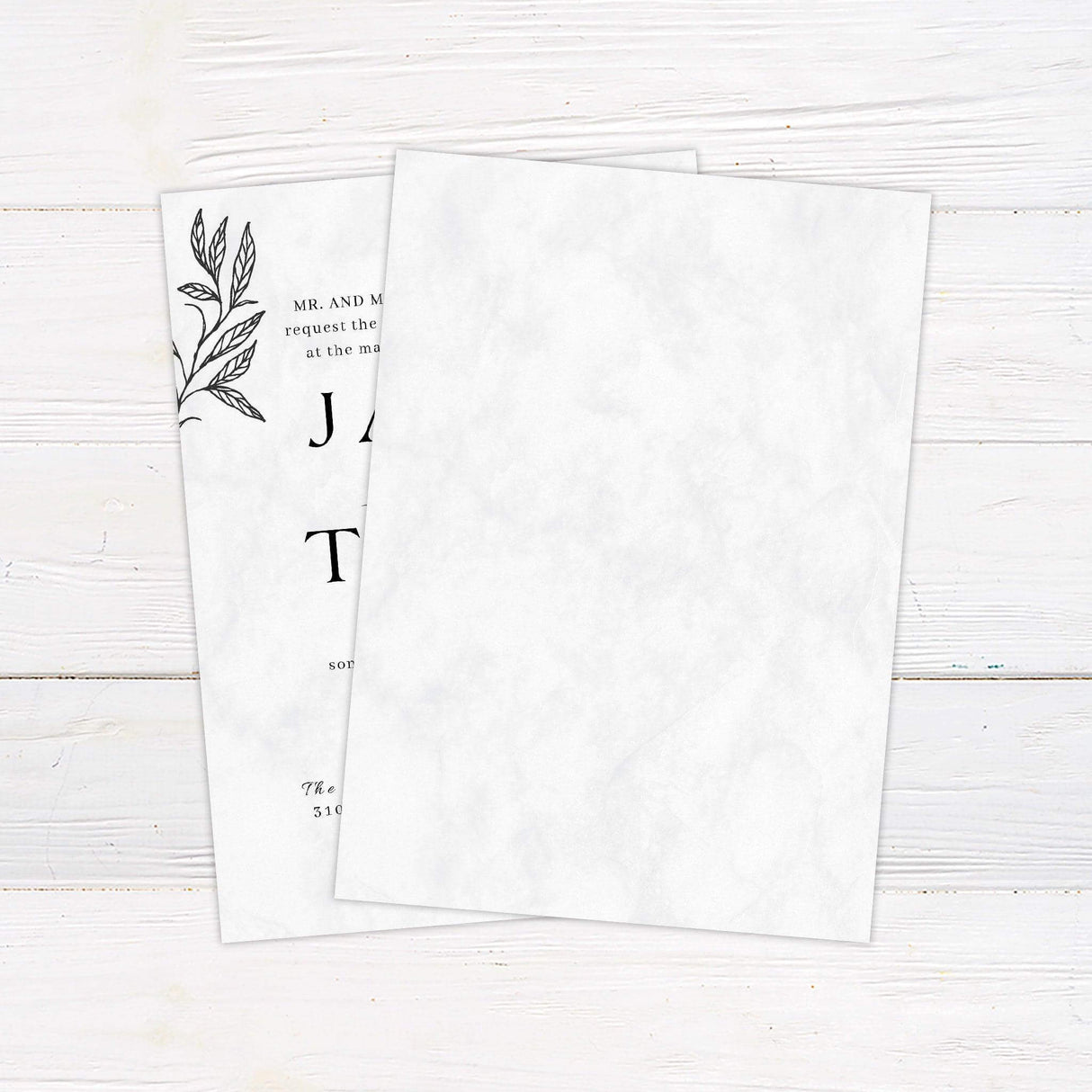 Modern botanical wedding invitation with marble background, outlined black leaves, and formal serif fonts—ideal for minimalist or fall weddings. back