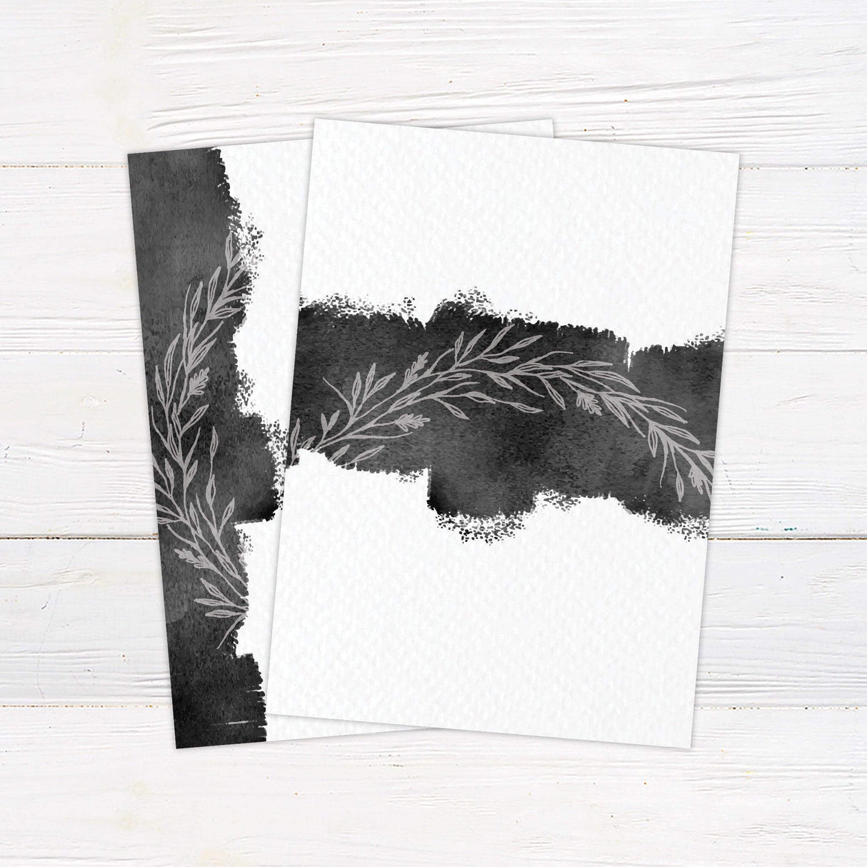 Modern black watercolor wedding invitation with minimalist botanical design, featuring elegant script and serif text for customizable wedding details. - back