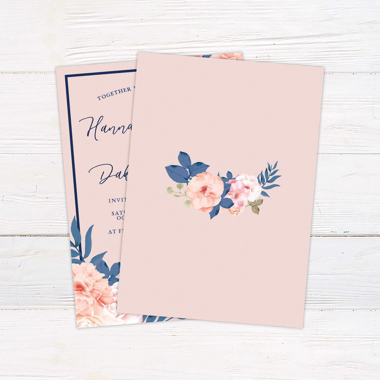 Pink wedding invitation with navy blue border and script text, decorated with blush and coral peonies.