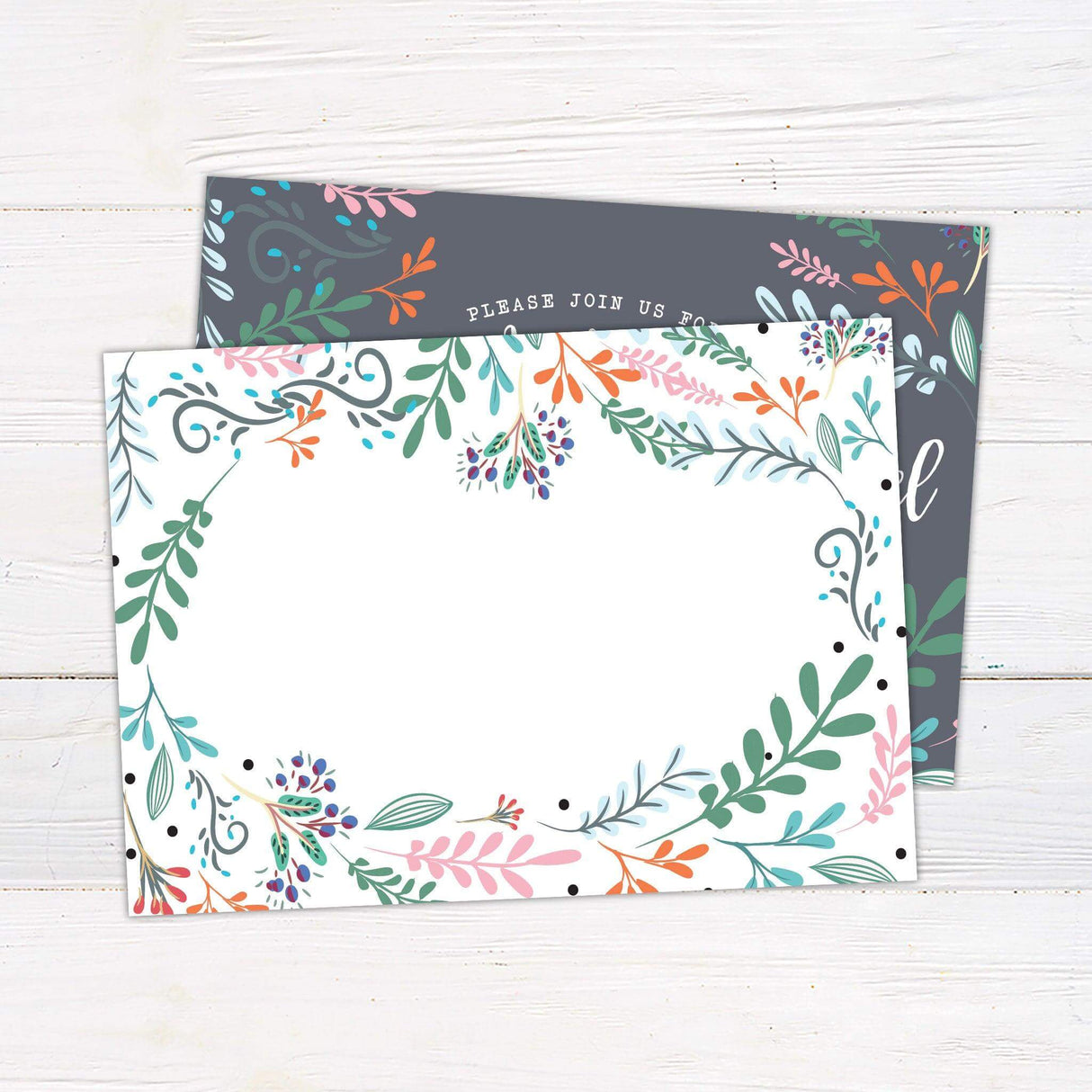 Rustic wedding invitation with navy blue background and colorful floral accents featuring playful typograph back