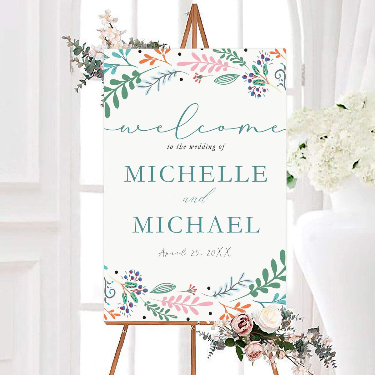 Whimsical wildflower garden wedding welcome sign featuring colorful botanical branches, leaves, berries, and floral accents. Personalized couple names and wedding date appear in the center of the design.