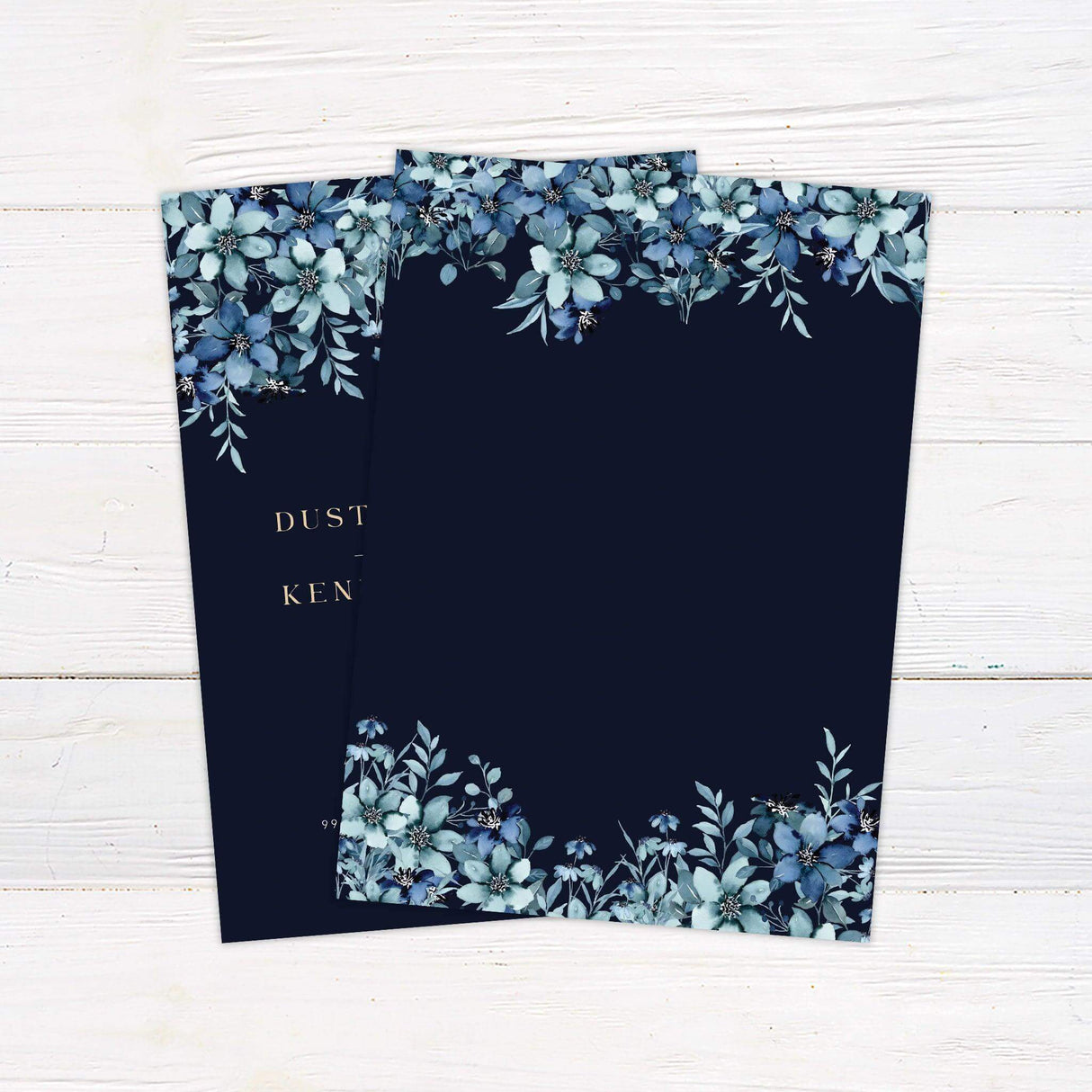 Elegant wedding invitation with navy background, cascading blue watercolor flowers, and gold serif typography—ideal for winter or evening weddings. back