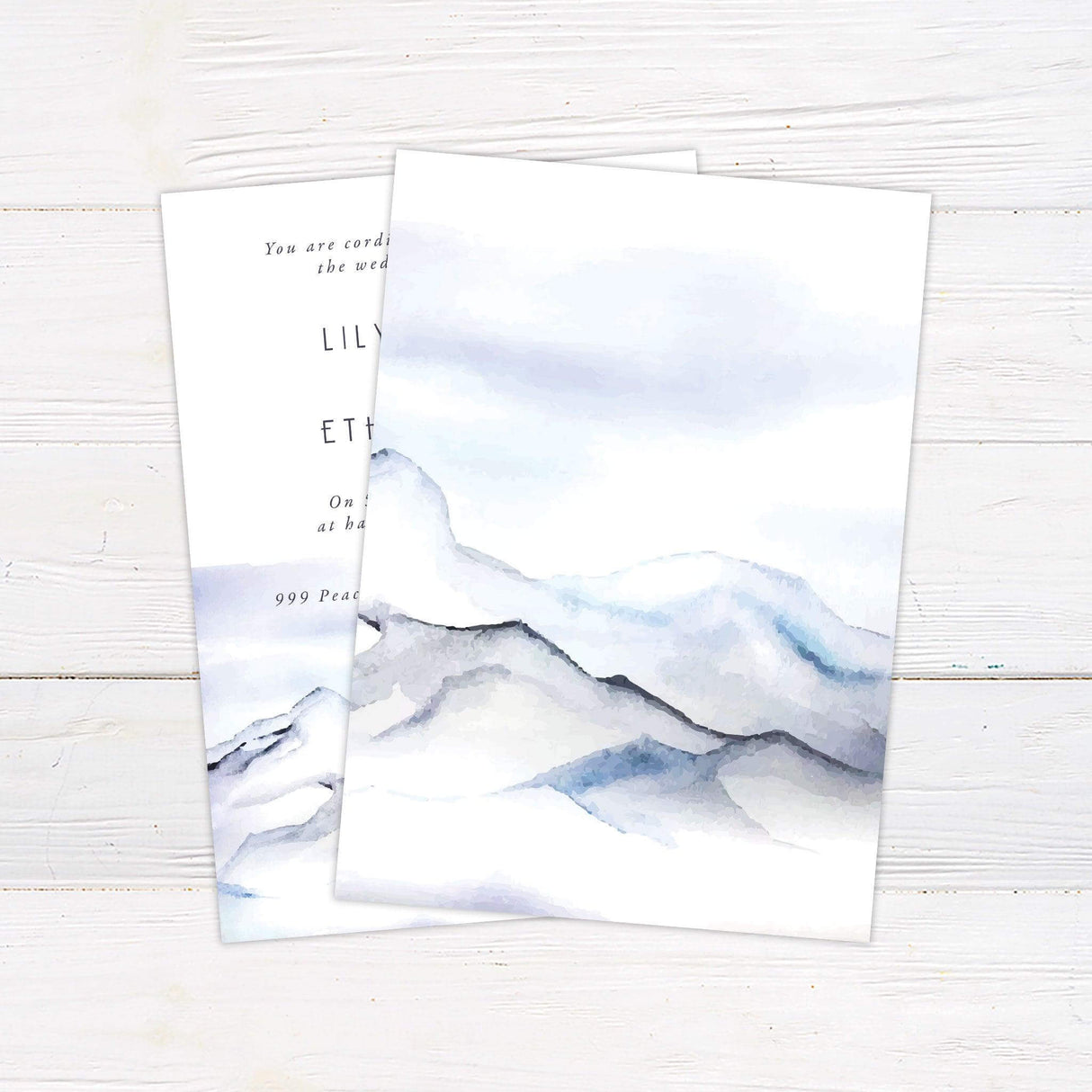 Elegant mountain wedding invitation with watercolor blue landscape and serif fonts—perfect for winter, outdoor, or destination ceremonies. back