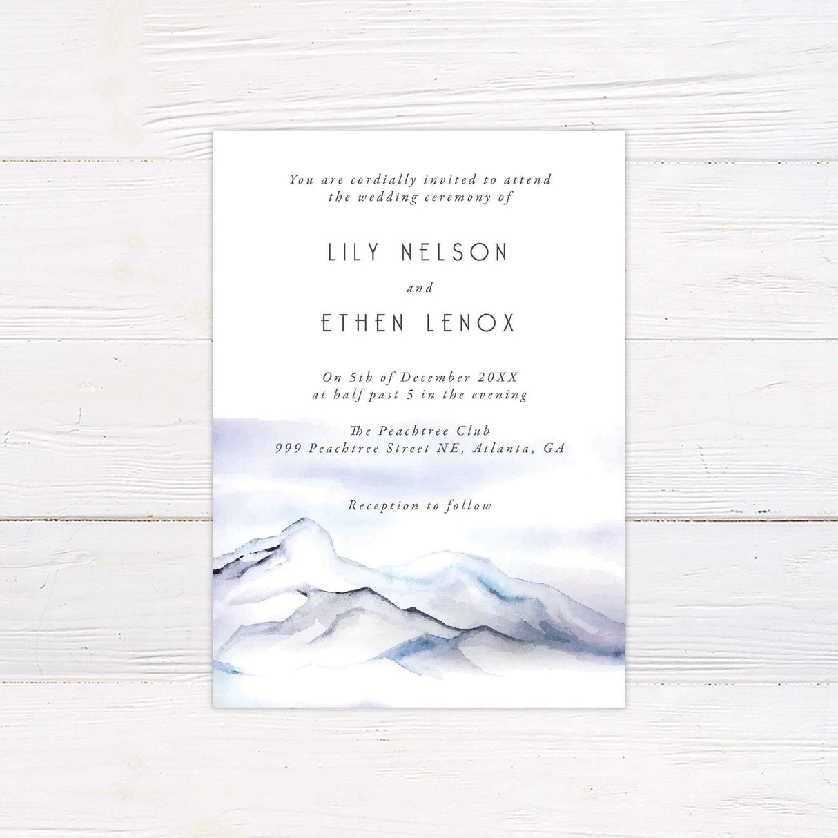Elegant mountain wedding invitation with watercolor blue landscape and serif fonts—perfect for winter, outdoor, or destination ceremonies.