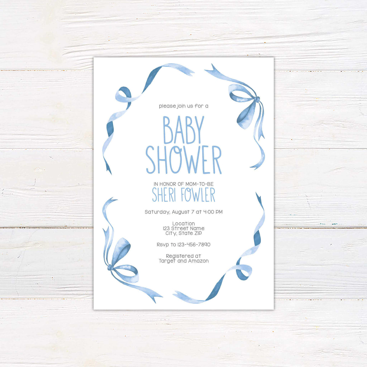 Elegant baby shower invitation featuring a soft watercolor design with flowing blue ribbons. The text is arranged in a stylish, modern font, inviting guests to celebrate the mom-to-be. Includes event details such as date, time, location, RSVP information, and gift registry. A beautiful choice for a classic and sophisticated baby shower theme.
