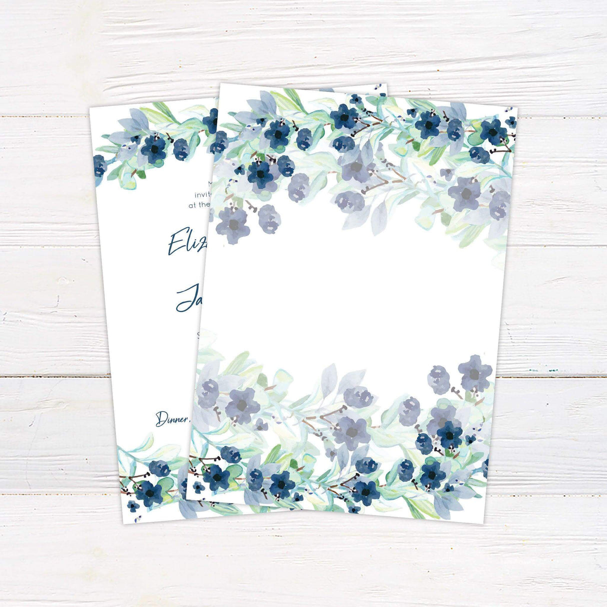 Blue floral wedding invitation with watercolor berry garlands, elegant script, and greenery—ideal for spring or outdoor garden weddings. back