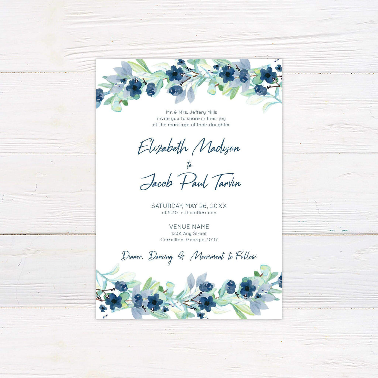 Blue floral wedding invitation with watercolor berry garlands, elegant script, and greenery—ideal for spring or outdoor garden weddings.