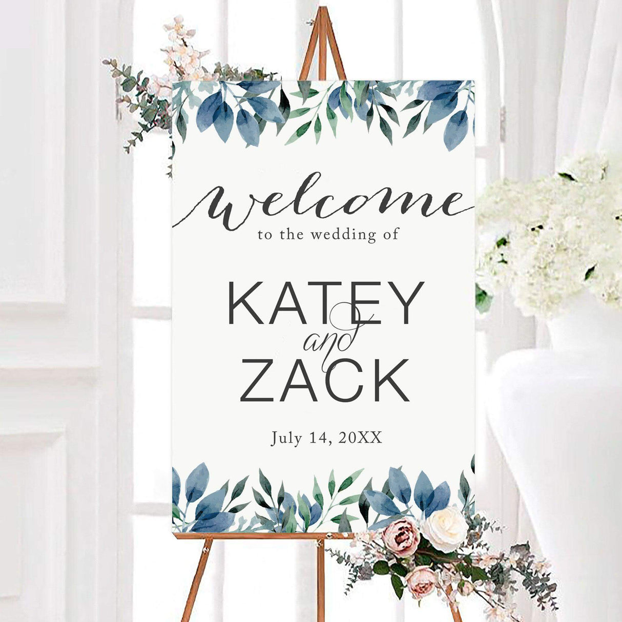 Elegant welcome signwith watercolor blue and green leaves and modern calligraphy on a white background.