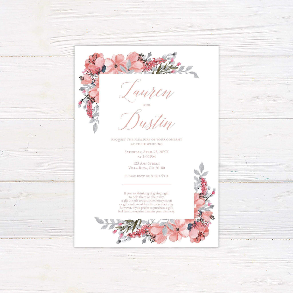Blush pink wedding invitation with watercolor floral border and elegant script—perfect for garden, spring, or romantic daytime weddings.