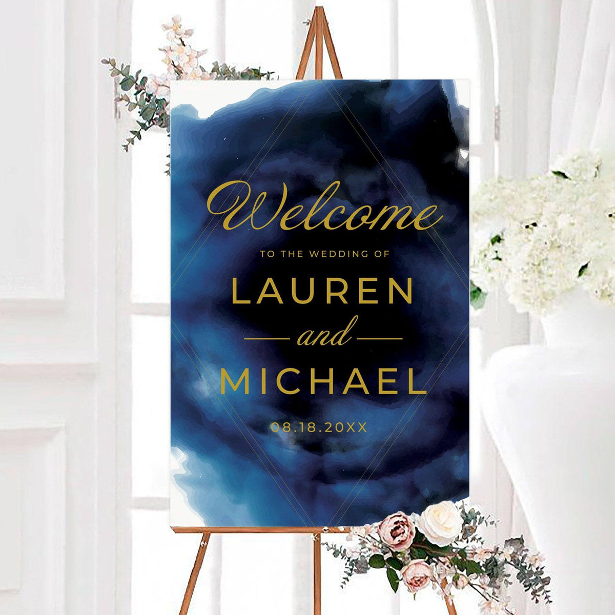 Personalized bold blue watercolor wedding welcome sign featuring a bold navy blue watercolor background, gold geometric line accents, and elegant script lettering. The modern blue and gold wedding entrance sign includes customizable couple's names and wedding date in sophisticated typography.