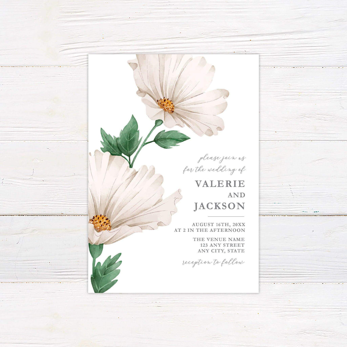 Elegant wedding invitation featuring watercolor ivory flowers with lush green leaves. The text is beautifully arranged in a mix of script and serif fonts, inviting guests to a special celebration. The details include the wedding date, time, venue, and a note about the reception. The soft floral design and neutral tones create a timeless and sophisticated look, perfect for a classic or botanical-themed wedding.