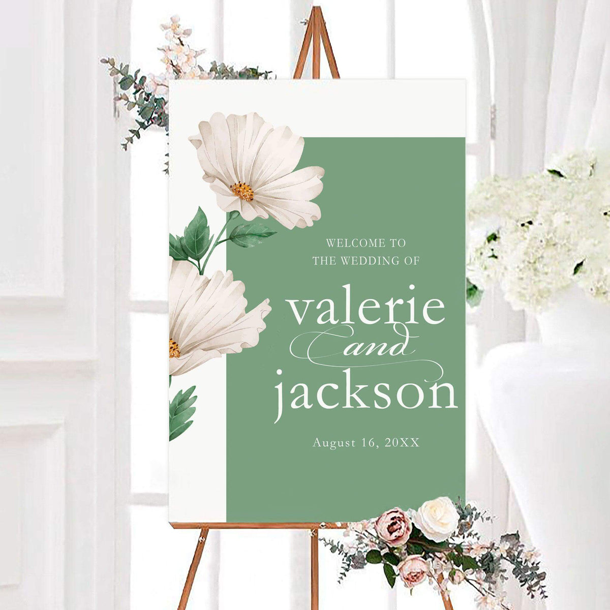 Personalized bold daisies wedding welcome sign featuring oversized white watercolor flowers, green botanical leaves, and a sage green background with elegant lettering. The floral wedding entrance sign includes customizable couple's names and wedding date in classic serif and flowing script typography.