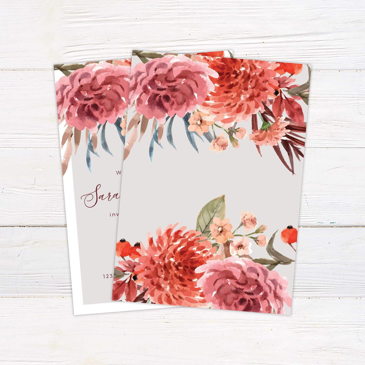 Wedding invitation with bold watercolor florals in pink and red, elegant script text, and a clean layout for a spring or summer celebration. back