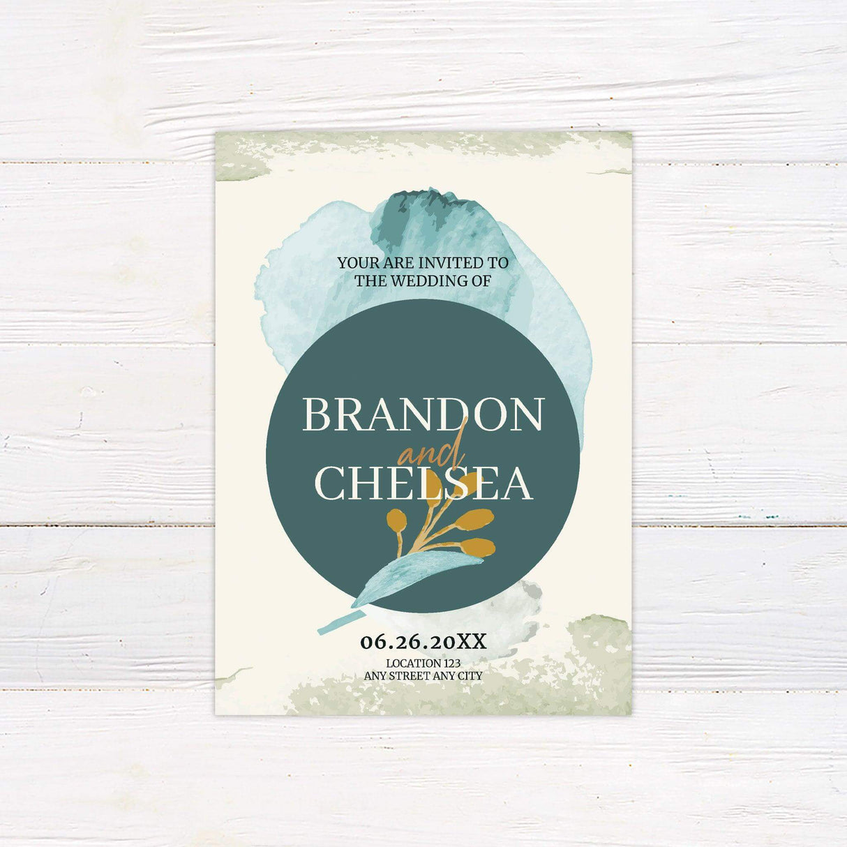Modern wedding invitation with bold teal circle, abstract watercolor background, and gold botanical illustration, featuring elegant typography