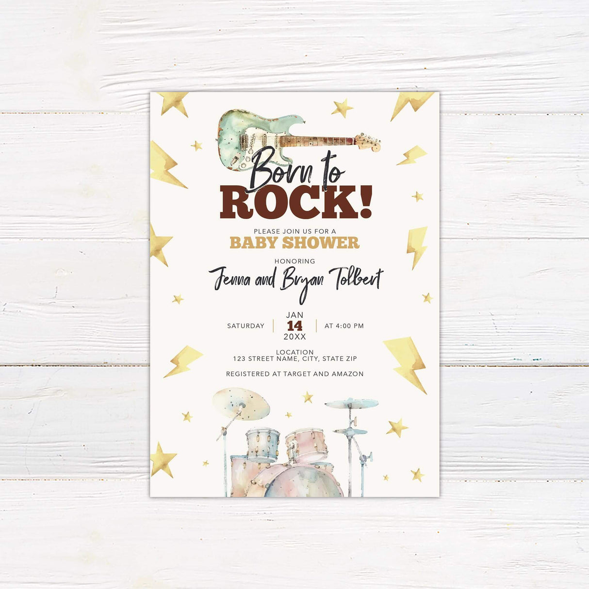 Inviting rock-themed baby shower invitation featuring a guitar, drum kit, stars, and lightning bolts on a white background.