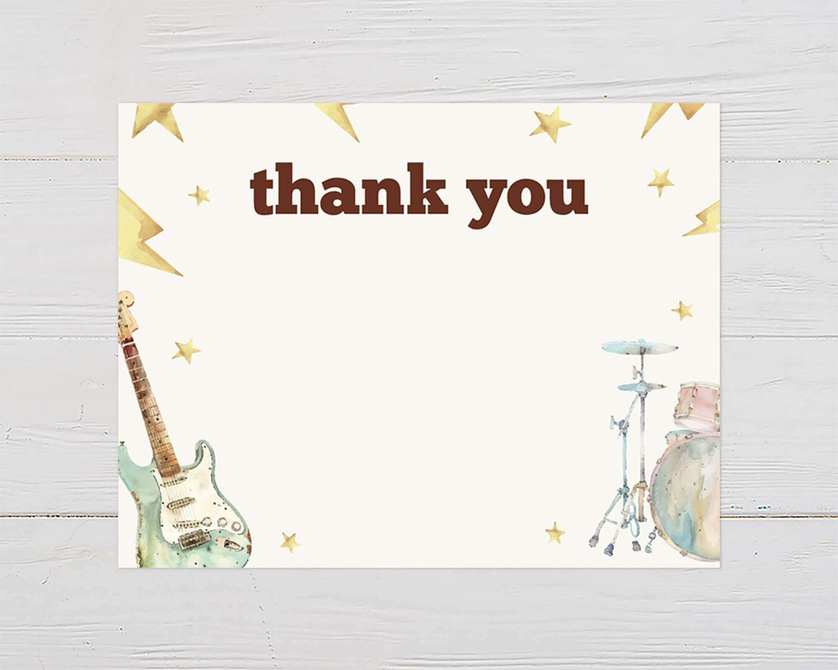 Born to Rock Baby Shower thank you card with electric guitar and drum set illustration, featuring stars and lightning bolts.
