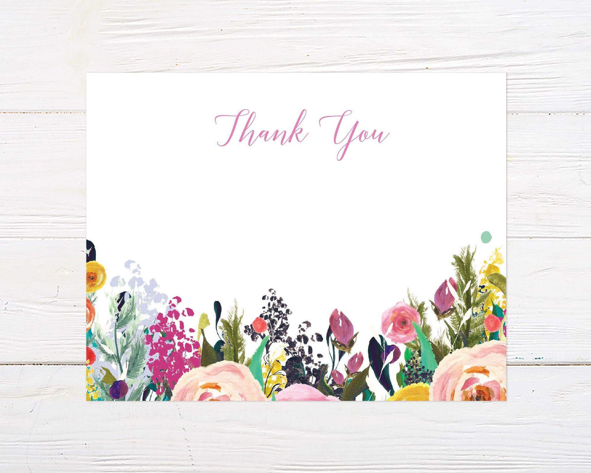 A bright floral bridal shower thank you card with colorful painted flowers at the bottom. The design features soft script text on a white background, perfect for leaving heartfelt messages for guests.