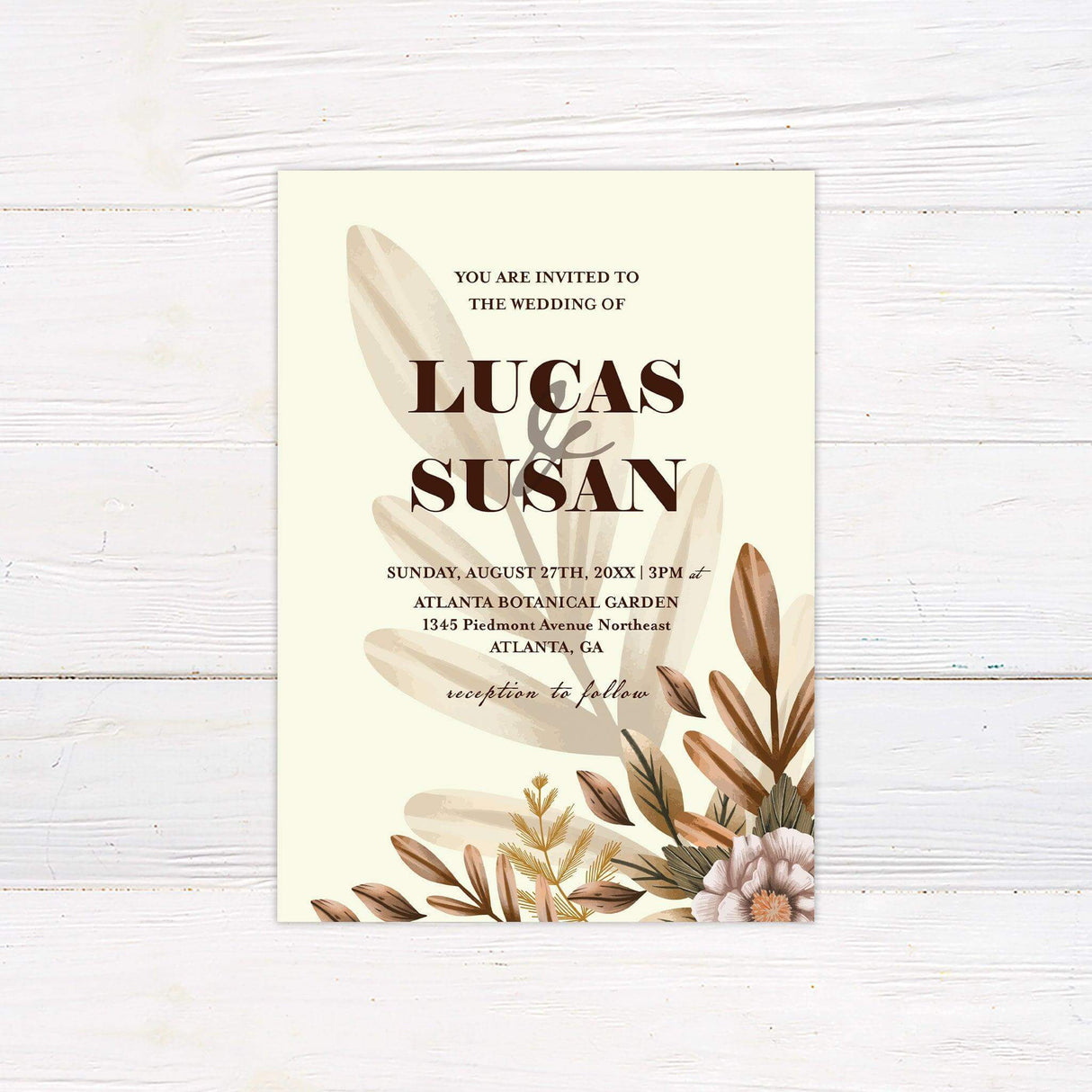 Boho botanical wedding invitation with earthy floral accents and elegant serif typography, ideal for garden or outdoor weddings.