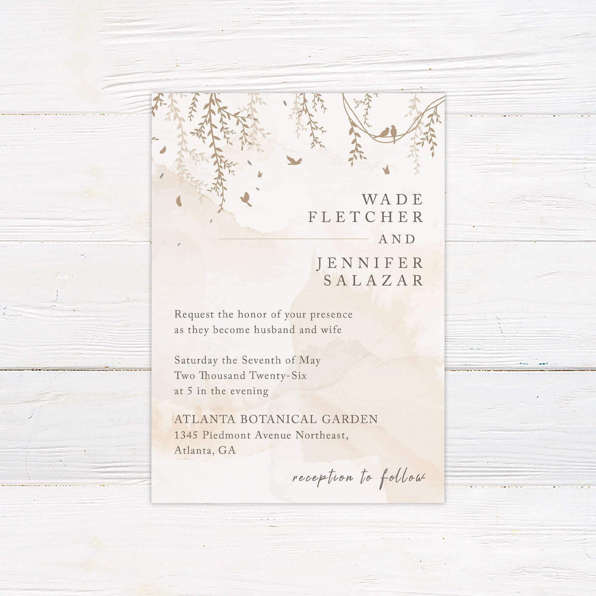 Botanical wedding invitation with hanging branches, birds, and elegant script, ideal for garden, woodland, or outdoor nature-themed weddings.