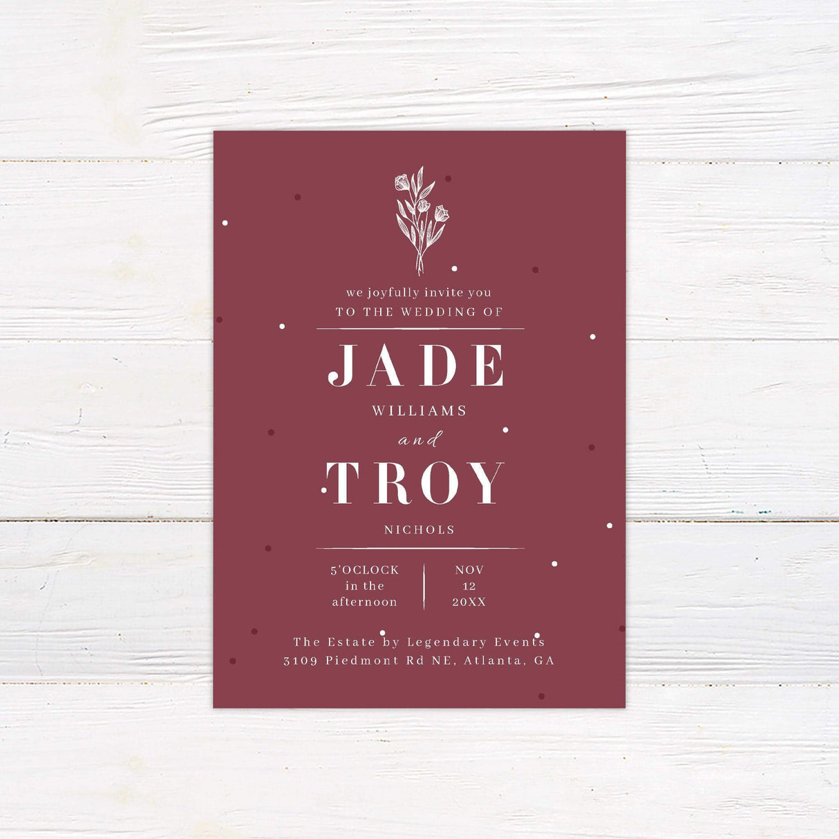 Minimalist burgundy botanical wedding invitation with elegant serif typography and floral illustration, perfect for modern or formal weddings.