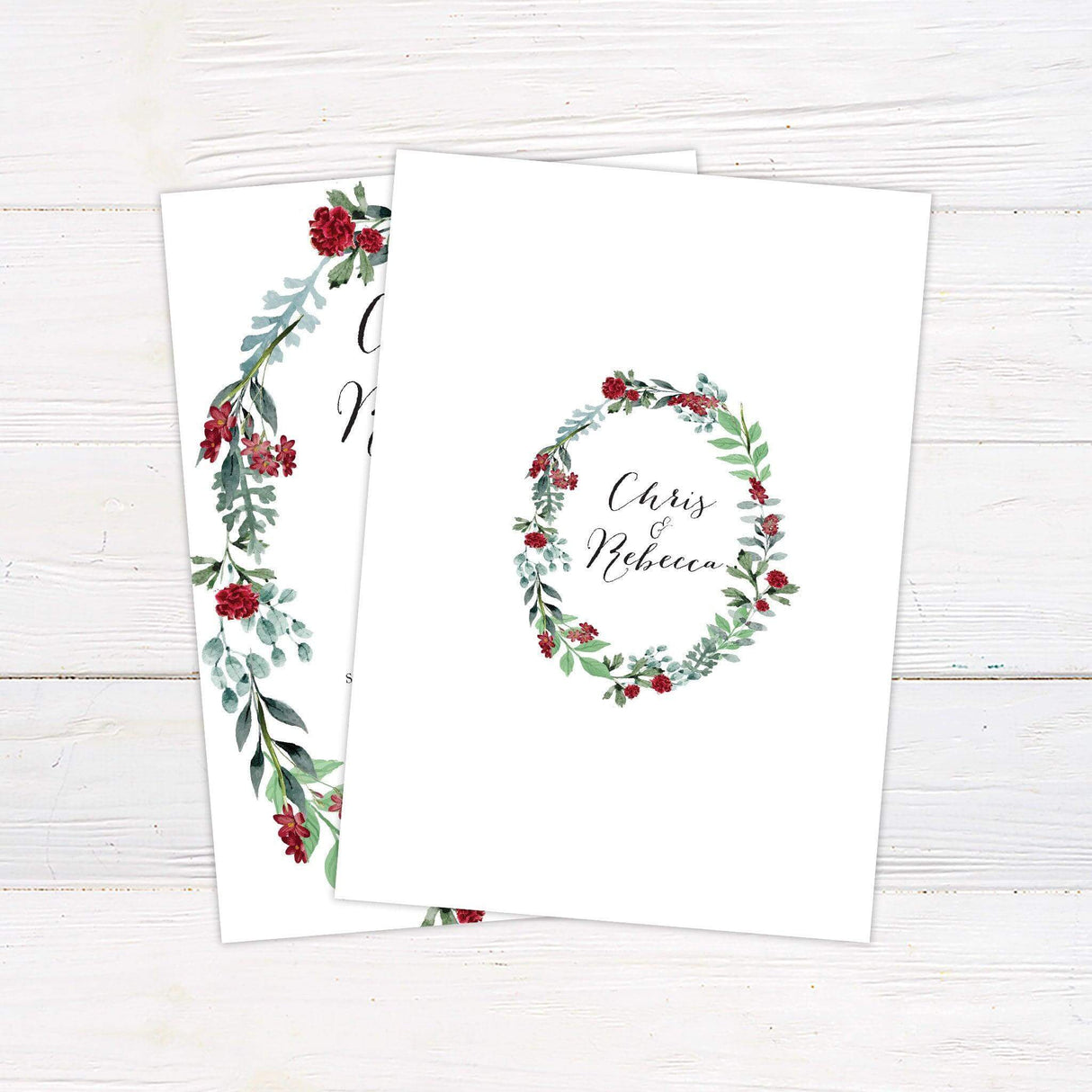Wedding invitation with a floral wreath of burgundy blooms and greenery, featuring elegant calligraphy and customizable ceremony details. - back