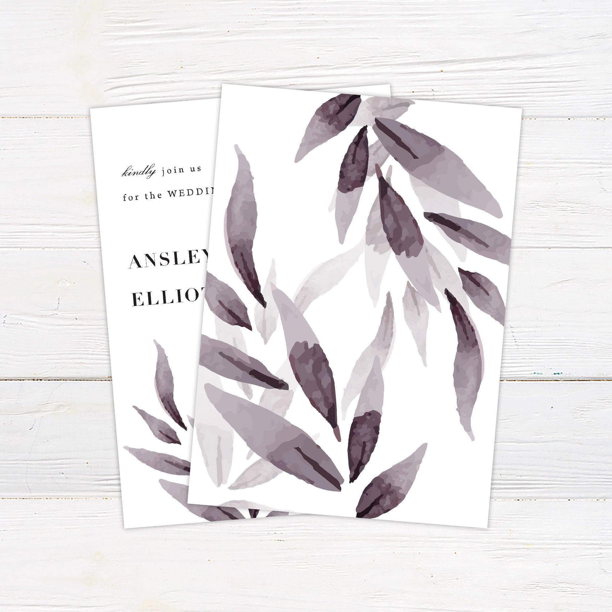 Minimalist wedding invitation with cascading watercolor purple leaves, modern serif typography, and calligraphy accents, printed on white cardstock - back
